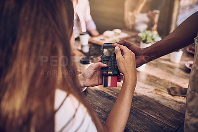 Buy stock photo Cropped shot of a woman ready to pay the bill at a cafe