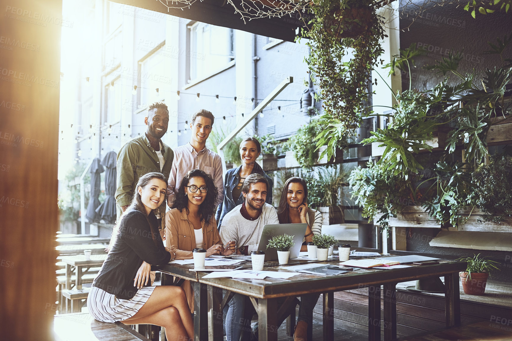 Buy stock photo Portrait of a group of colleagues having a meeting at a cafe
