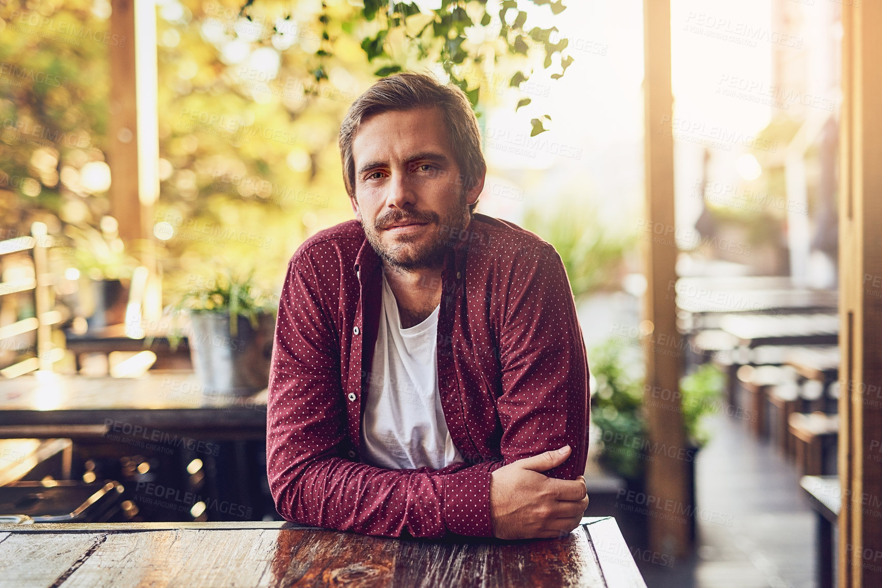 Buy stock photo Cropped portrait of a handsome man sitting outside