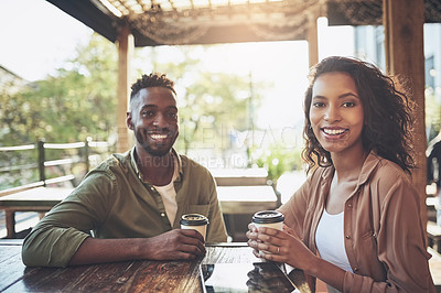 Buy stock photo Cropped shot of a young couple in a coffee shop