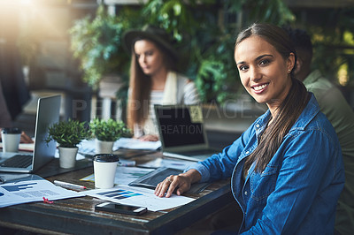 Buy stock photo Portrait of a young designer having a meeting with her colleagues at a coffee shop