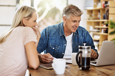 Buy stock photo Cropped shot of a mature couple enjoying some coffee in the morning