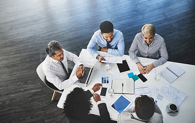 Buy stock photo Shot of a group of businesspeople having a meeting in an office