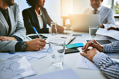 Buy stock photo Shot of a group of businesspeople having a meeting in an office