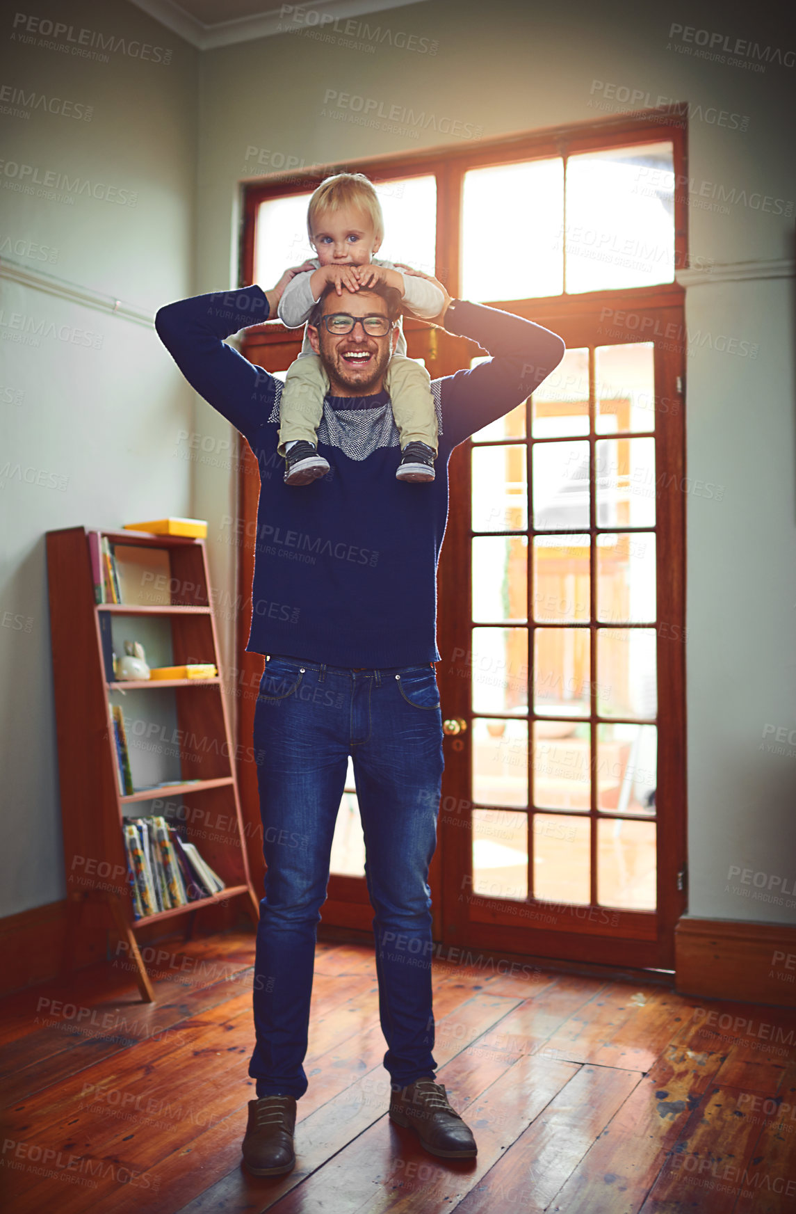 Buy stock photo Happy, father and baby on shoulders for portrait, love and support in living room. Dad, kid and together at family home for play, bonding and child growth or development on fathers day in Canada