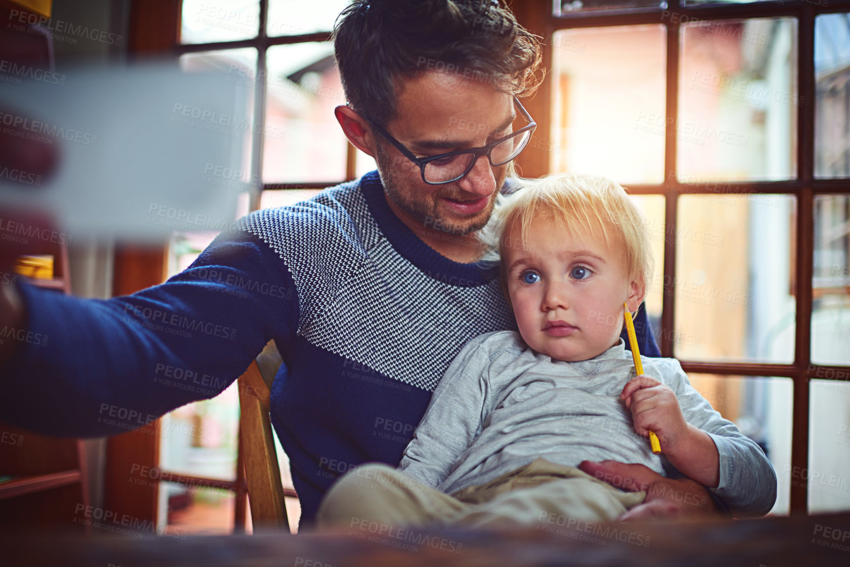 Buy stock photo Dad, baby boy and selfie in home with smile, memory and connection with post on social network. Man, father and child with photography, bonding and profile picture with mobile app in family house