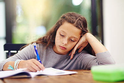 Buy stock photo Cropped shot of a young girl doing homework inside