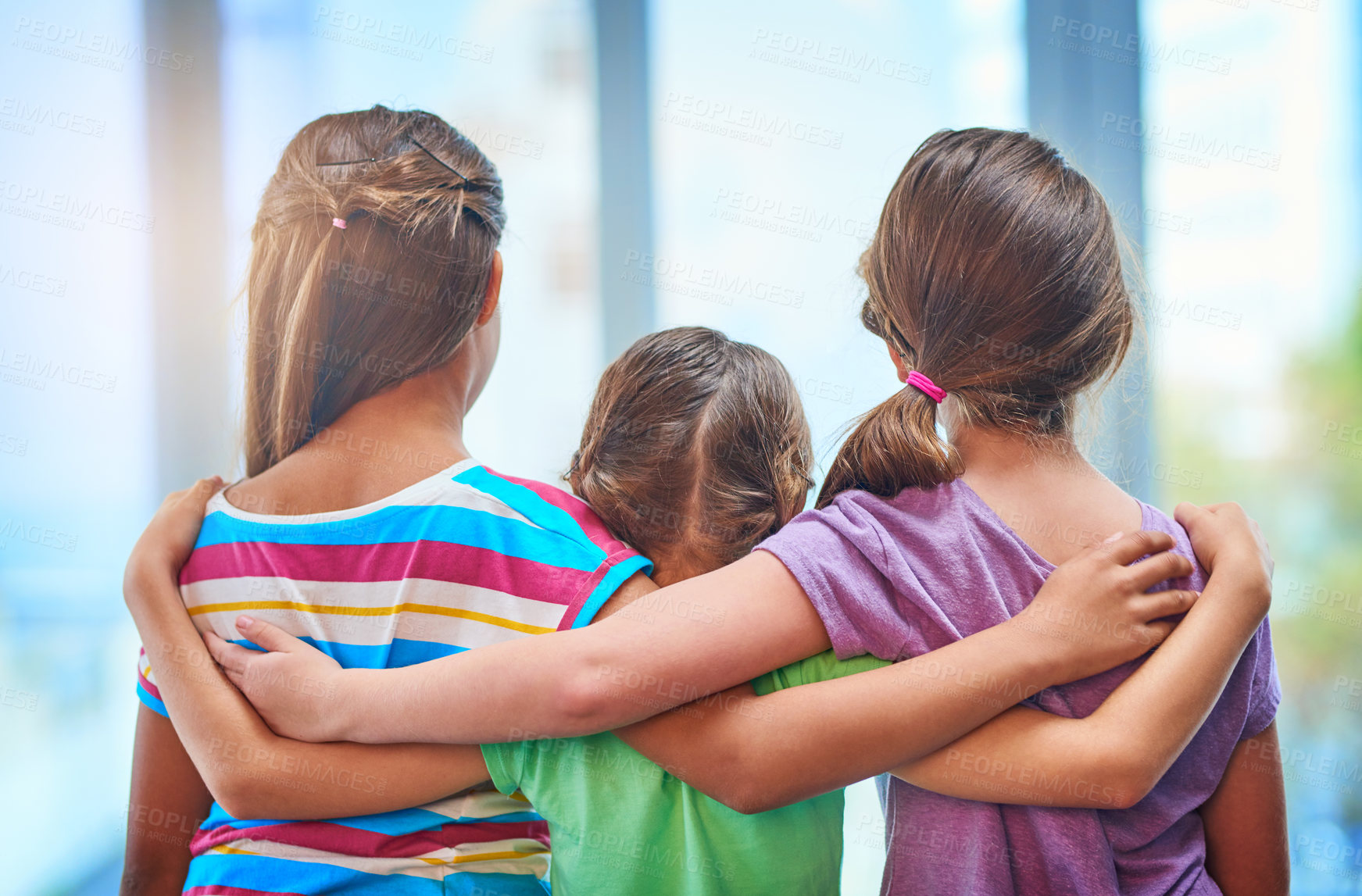 Buy stock photo Back, children and friends with hug for care, connection and bonding together with support in kindergarten. Young girls, kids and love with embrace for solidarity, development and childhood growth