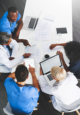 Buy stock photo Doctors, medical professionals or healthcare workers with laptop talking, meeting or planning hospital medicine treatment. Above view of diverse group of physician colleagues brainstorming with tech