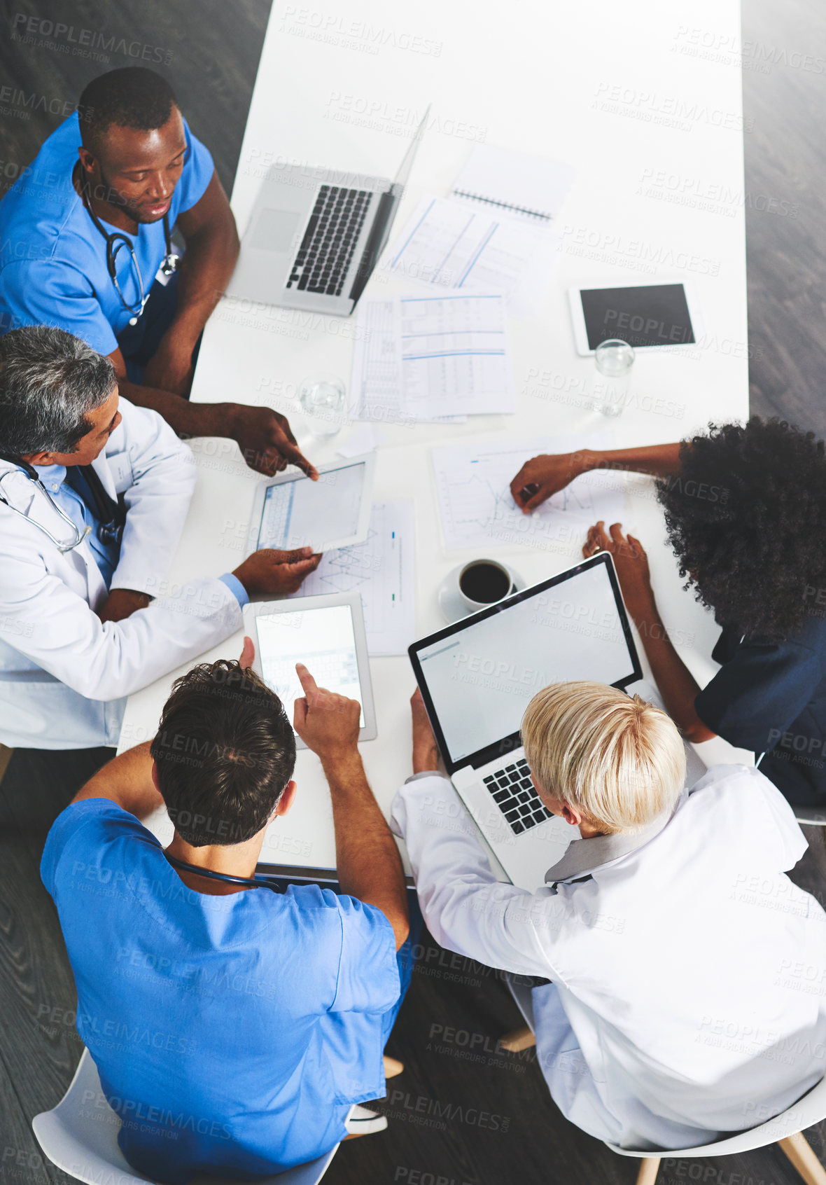 Buy stock photo Doctors, medical professionals or healthcare workers with laptop talking, meeting or planning hospital medicine treatment. Above view of diverse group of physician colleagues brainstorming with tech