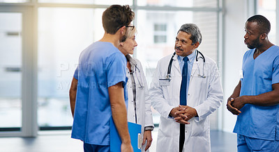 Buy stock photo Talking doctors, medical professionals and healthcare workers planning or brainstorming hospital medicine treatment. Diverse group of frontline clinic colleagues discussing new breakthrough in virus 