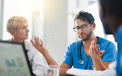 Buy stock photo Group of medical doctors planning, brainstorming and discussing patients records in a meeting. Healthcare professional team leader briefing colleagues about reports in hospital boardroom. 