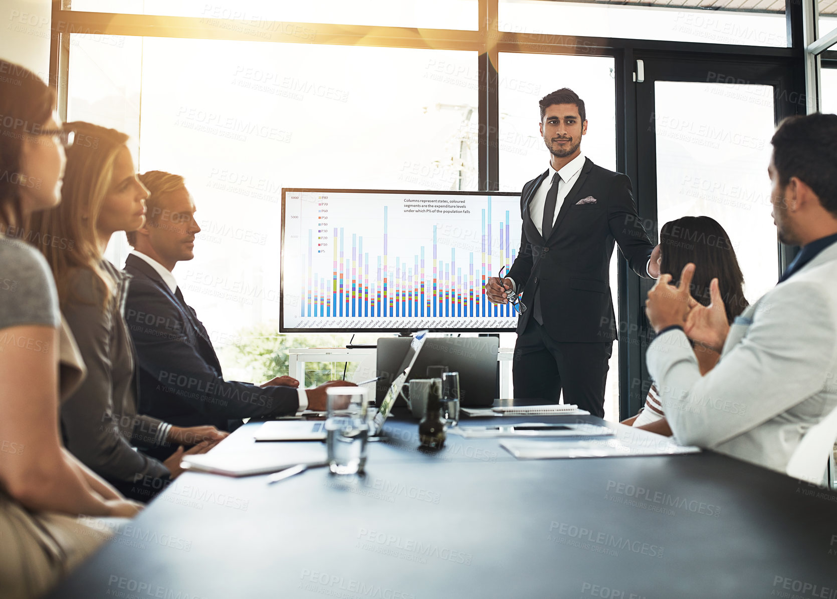 Buy stock photo Shot of a businessman delivering a presentation to coworkers in the boardroom