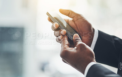Buy stock photo Closeup shot of an unrecognisable businessman using a cellphone in an office