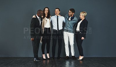Buy stock photo Studio shot of a group of businesspeople standing against a grey background