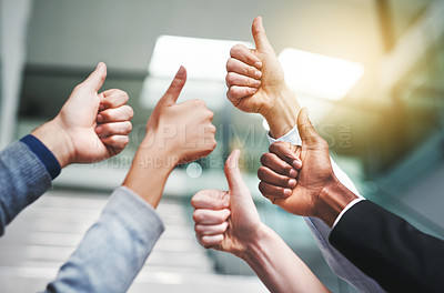 Buy stock photo Thumbs up, success and teamwork with hands of business people in office for agreement, like and yes. Emoji, support and community with group of employees for goals, thank you and motivation