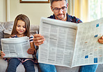 Reading the news, just like her dad