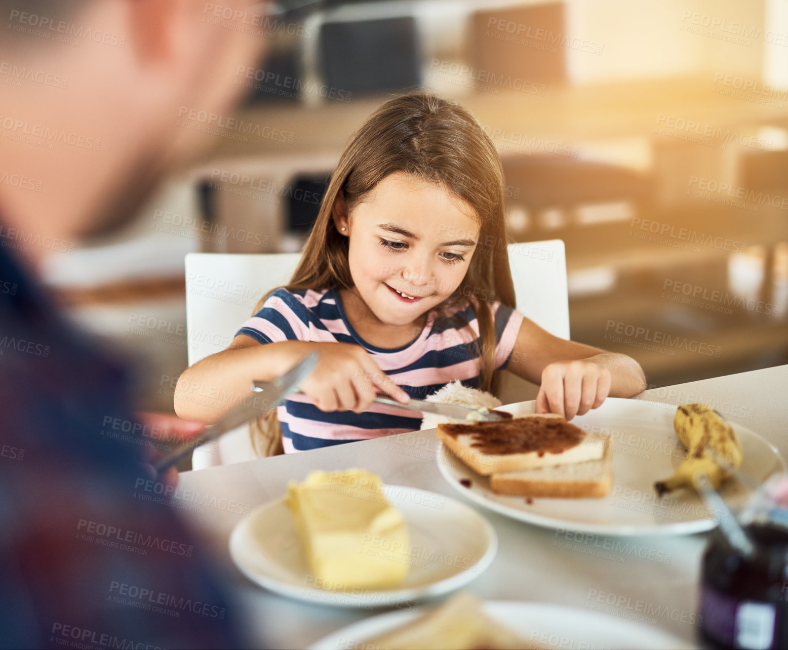 Buy stock photo Breakfast, bread and daughter with dad, smile or morning in kitchen, butter and dining table in home. Healthy, father and food of family, child and man in house, eating and bonding with love together