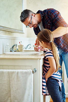 Buy stock photo Father, girl and brushing teeth in bathroom, bonding and cleaning together. Dad, child and toothbrush for dental hygiene, oral wellness or healthy tooth for family care, teaching and learning in home