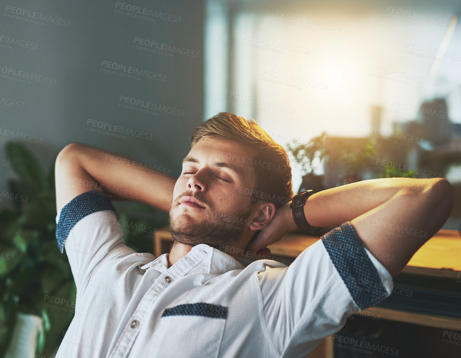 Buy stock photo Night, relax and business with man, sleeping and tired with finished project, overworked and burnout. Hands behind head, employee and graphic designer in modern office, exhausted and fatigue