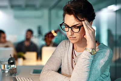 Buy stock photo Shot of a young businesswoman experiencing a headache at the office