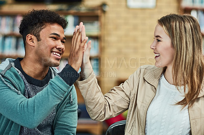 Buy stock photo Women, man and high five at university for knowledge, teamwork or success for thesis. Students, celebrate and happiness with hands together for education, collaboration or partnership for school work