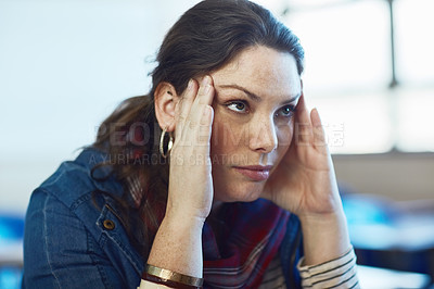 Buy stock photo Shot of a university student looking stressed out at campus