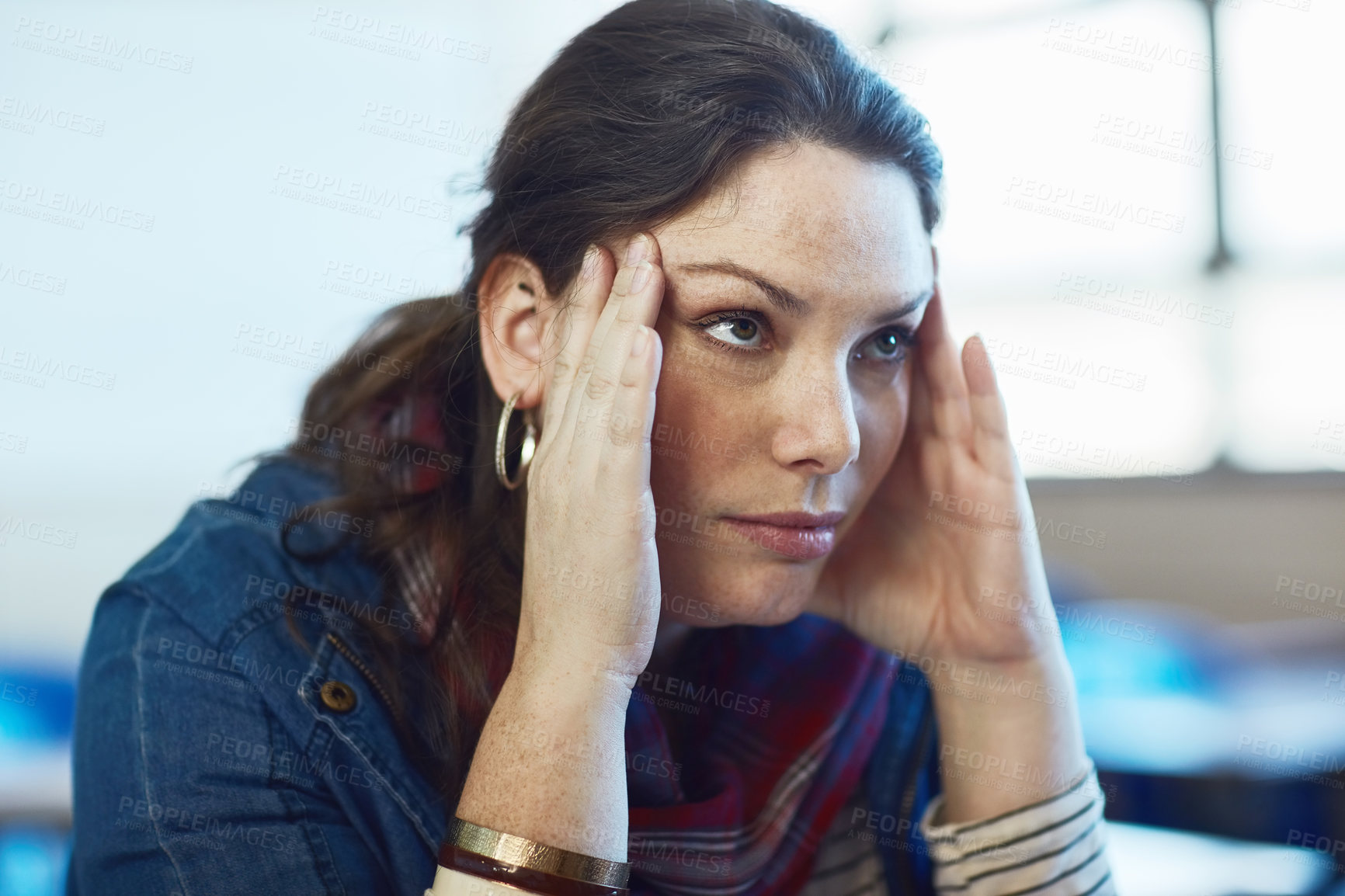 Buy stock photo Shot of a university student looking stressed out at campus