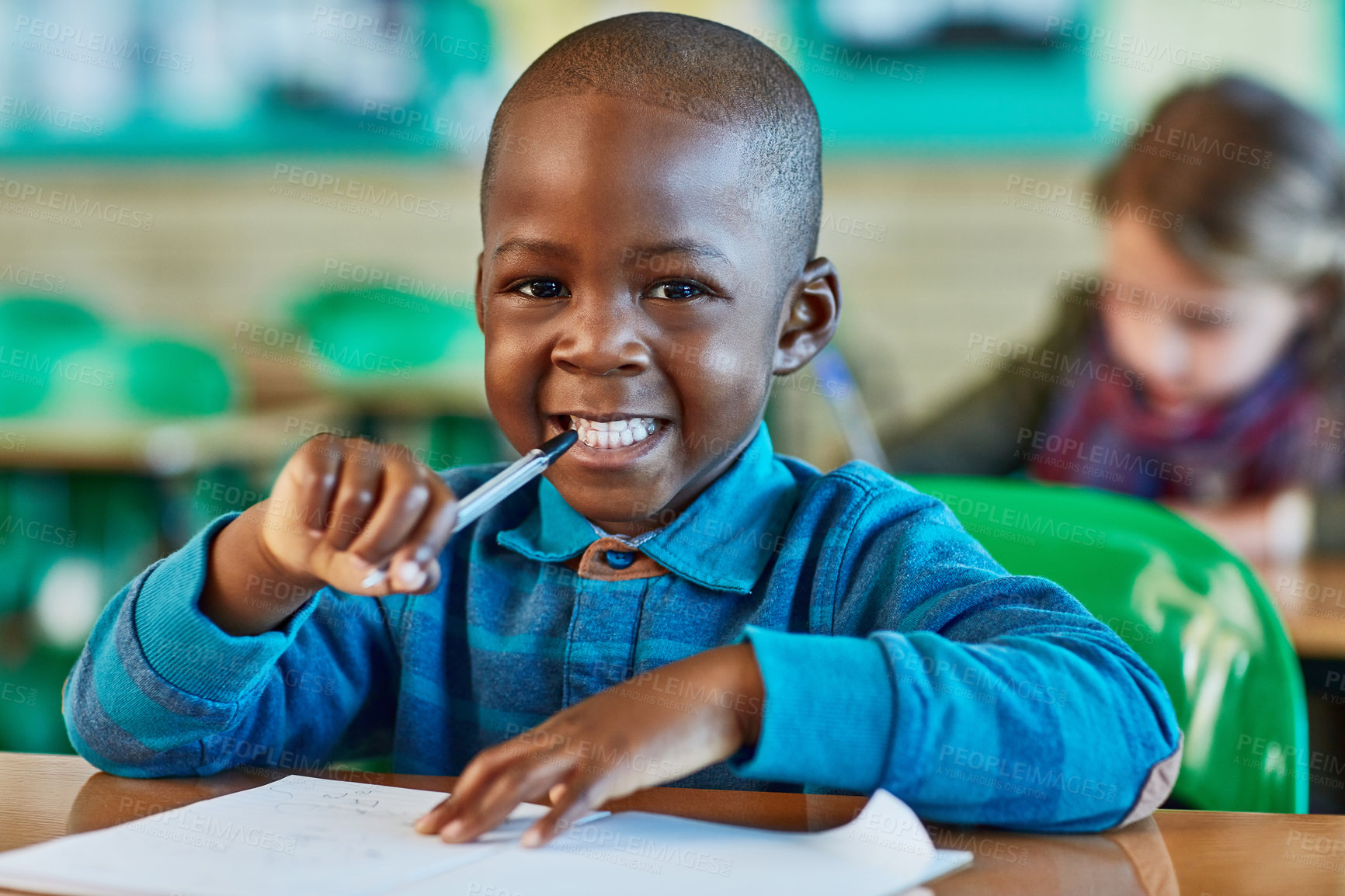 Buy stock photo Elementary school, classroom and portrait of boy with paper for learning, knowledge and assessment. Black kid, face and happy by desk with pen for child development, lesson and growth in education