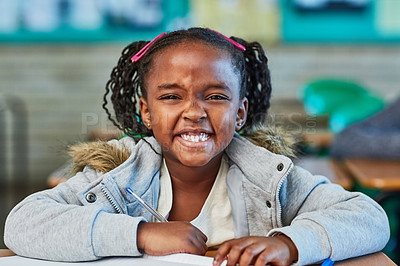 Buy stock photo Cropped shot of an elementary school girl in the classroom
