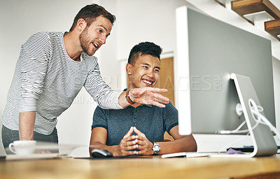 Buy stock photo Cropped shot of two designers working together on a project in an office