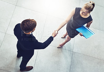 Buy stock photo Handshake, partnership and business people in office with deal, collaboration or b2b agreement. Professional, meeting and aerial view of hr shaking hands with candidate for onboarding in workplace.