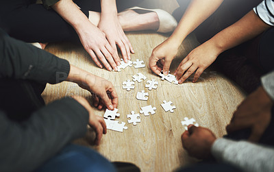 Buy stock photo People, support and hands with puzzle on table for problem solving, interaction and teamwork in integration. Diversity, team and training with jigsaw for creative strategy, collaboration and learning