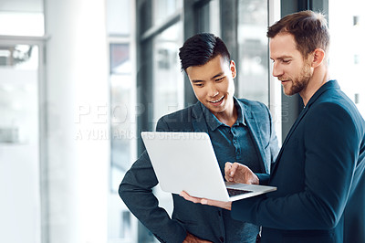 Buy stock photo Technology, colleagues with a laptop and at a modern office together at their workplace. Connectivity or social networking, teamwork or collaboration and coworkers with help at workspace with smile