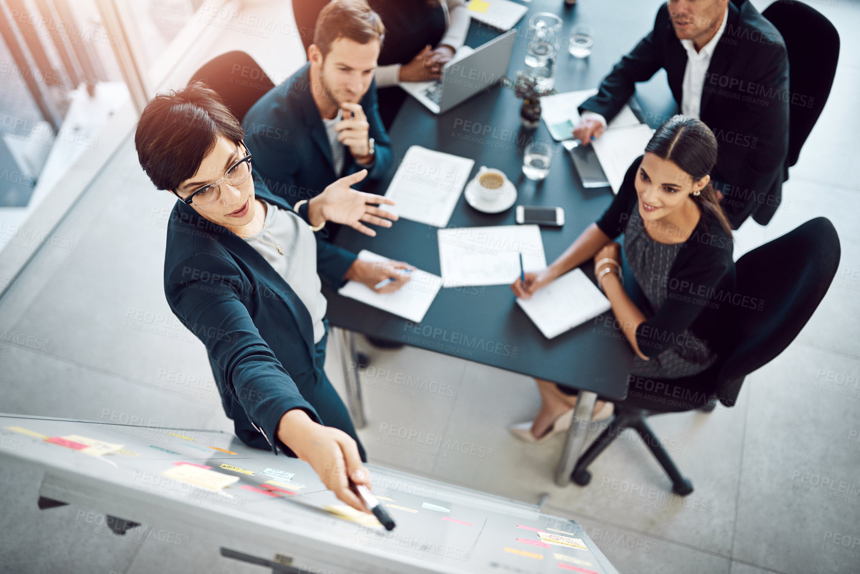 Buy stock photo Shot of businesspeople having a meeting in a boardroom