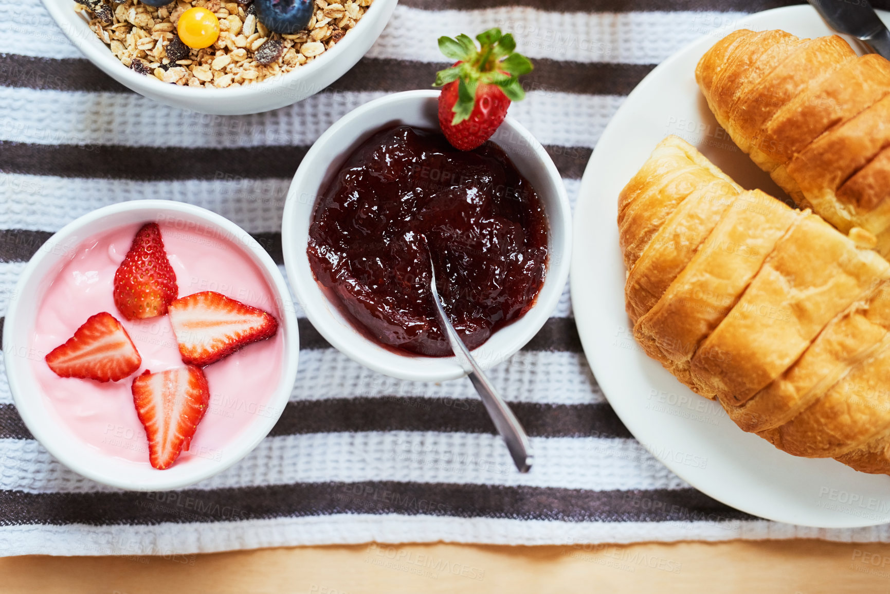 Buy stock photo Above, breakfast and tray in hotel with food, fresh fruit and spread for croissant. Hospitality, meal and room service in luxury accommodation for nutrition, healthy brunch and serving in morning