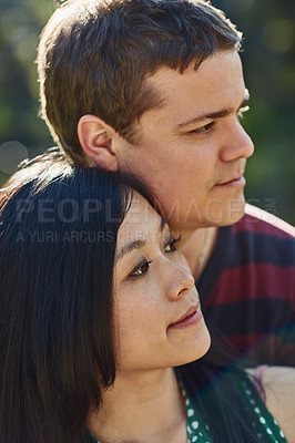 Buy stock photo Shot of a young couple spending quality time together outdoors