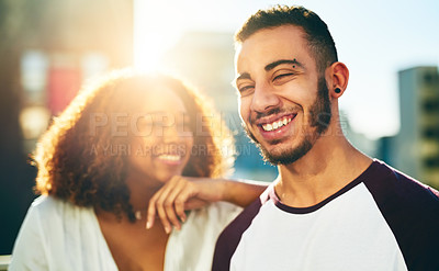 Buy stock photo Shot of a young couple outside