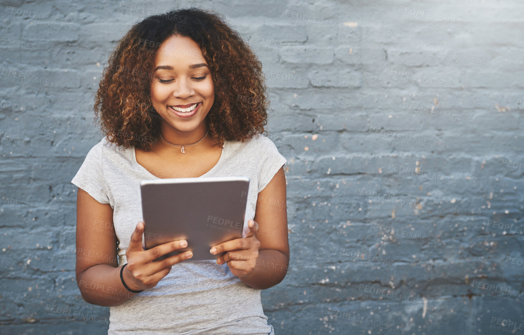 Buy stock photo Mock up, smile and tablet with designer black woman on brick wall background for creative research. Internet, project management and tech with happy employee on space for professional web development