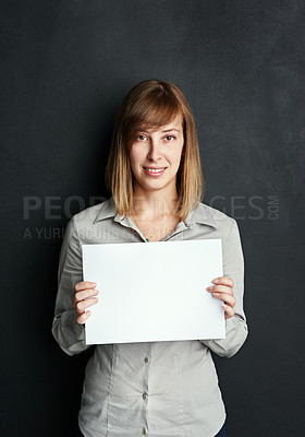 Buy stock photo Mockup, portrait and woman with poster for advertising board, branding or marketing info in studio. Female person, blank paper and banner with space for promotion, design and news on black background