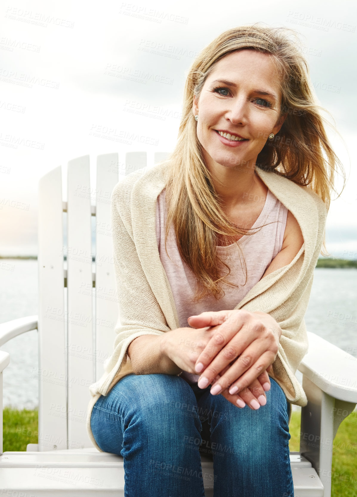 Buy stock photo Mature woman, peace and portrait outdoor for travel, holiday and mindfulness by lake with happiness. Female person, calm and face in nature for vacation, summer or wellness by pond with smile or hope