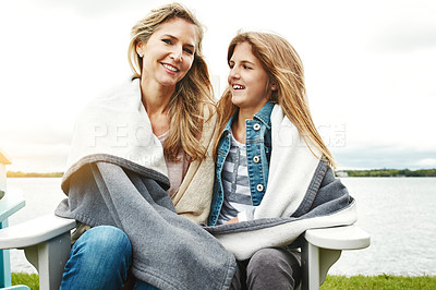 Buy stock photo Shot of a mother and her daughter bonding outdoors