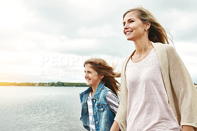 Buy stock photo Shot of a mother and her daughter bonding outdoors