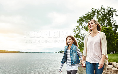 Buy stock photo Holding hands, lake or love with mother and daughter outdoor in nature together for bonding. Family, summer or walking with woman and girl child by water in park for security, support or trust