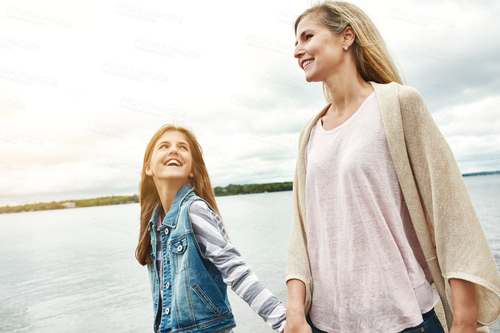 Buy stock photo Shot of a mother and her daughter bonding outdoors