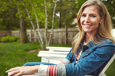 Buy stock photo Shot of a mature woman sitting in her backyard