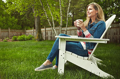 Buy stock photo Coffee, calm and woman relaxing in backyard for peace and break on weekend at home in Canada. Smile, nature and mature female person on outdoor chair drinking cappuccino, latte or espresso in garden.