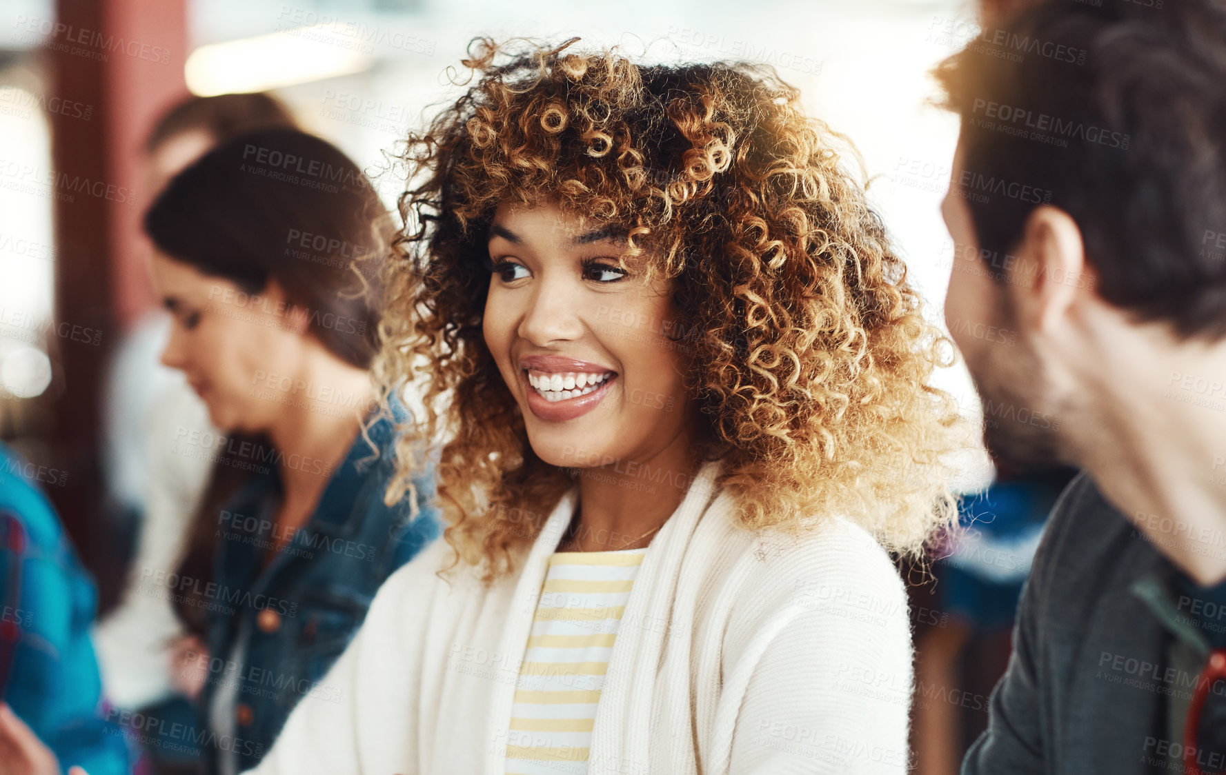 Buy stock photo Shot of an attractive young woman enjoying herself with company at a bar