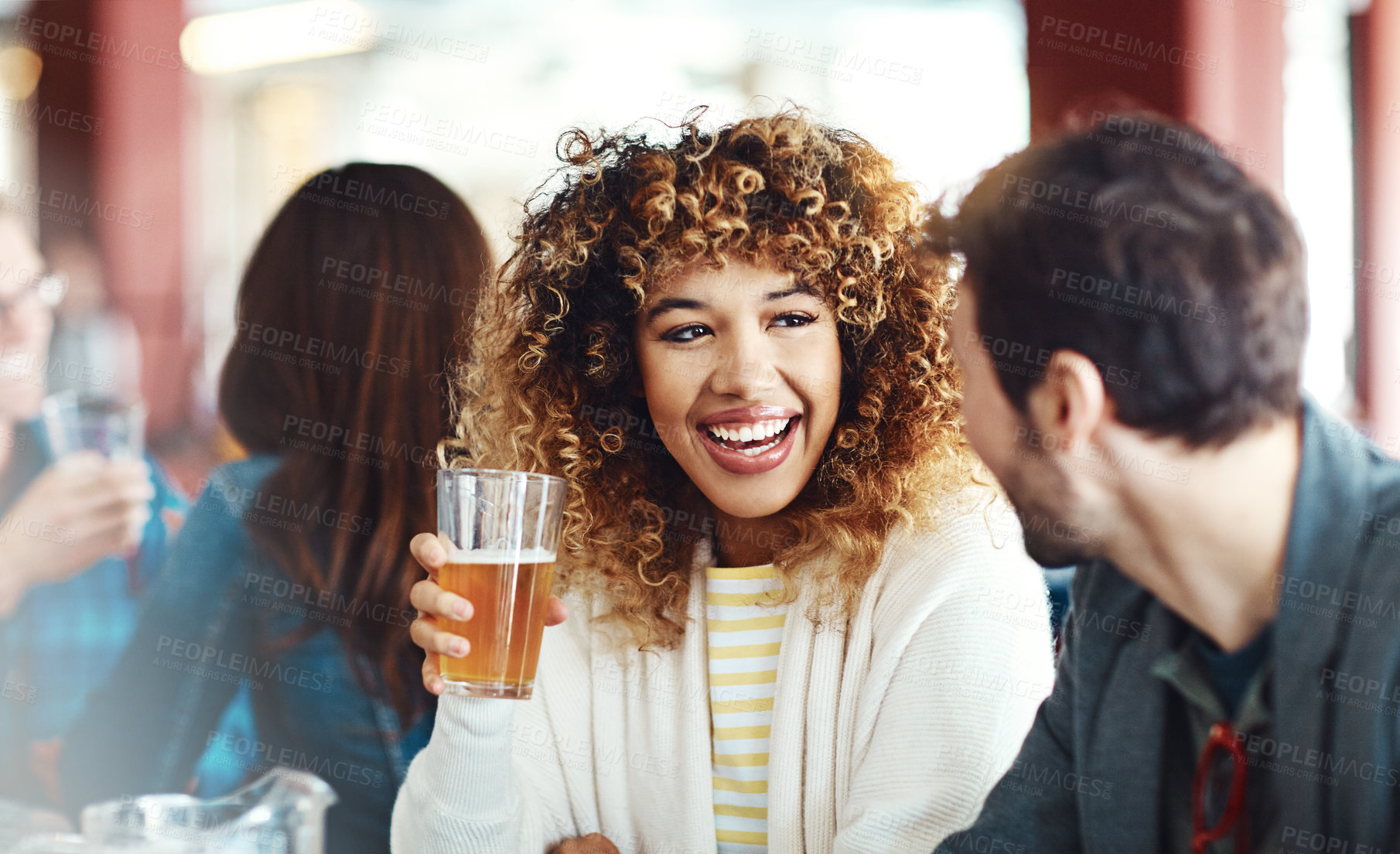 Buy stock photo Shot of a couple enjoying a drink at a bar