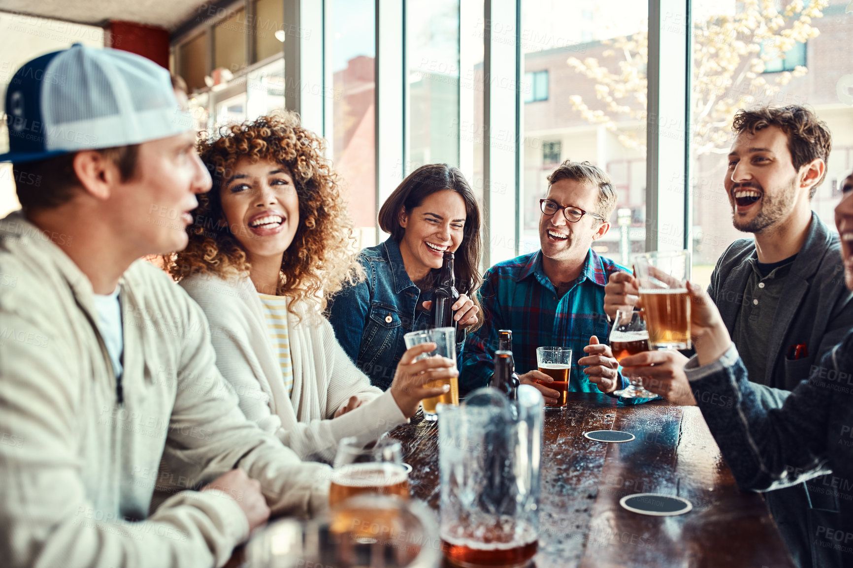 Buy stock photo Restaurant, beer and people at hangout in celebration of birthday event in urban New York bar. Group of friends with smile for happiness and gathering together with alcohol beverage at summer lunch